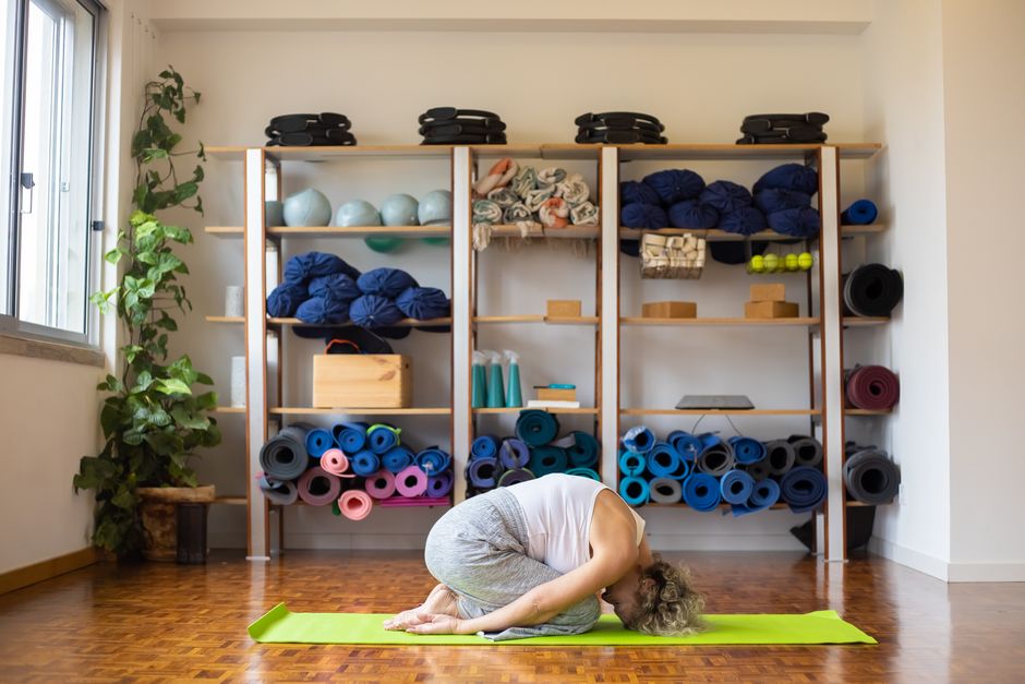 Soft lighting in a restorative yoga studio room