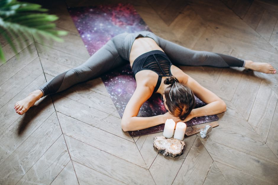 A student held in a supported seated yin yoga pose